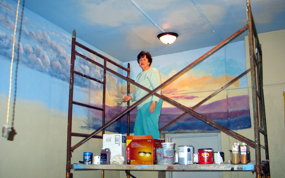 Bonnie Dickson atop scaffolding in the new library